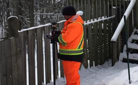 Image of Dean working as a land surveyor